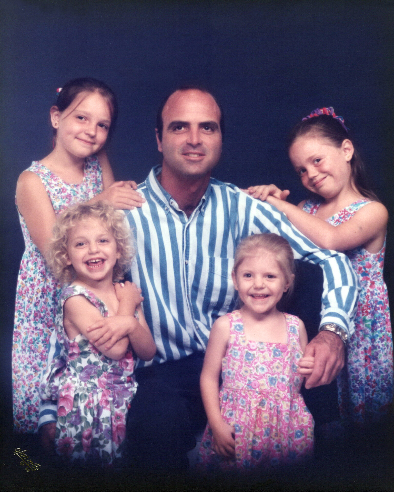 Family portrait, a father and his daughers